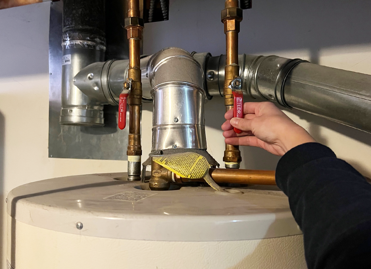 Can I replace the anode rod in the water heater myself?